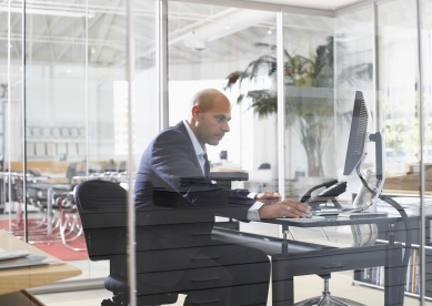 Man looking at computer in office